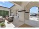 Covered patio featuring cozy seating, modern design, and views of the neighborhood, perfect for relaxation and entertaining at 20426 E Arroyo Verde Dr, Queen Creek, AZ 85142