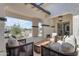 Charming covered patio with cozy seating arrangements and lovely views of the surrounding landscape at 20426 E Arroyo Verde Dr, Queen Creek, AZ 85142