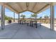 Shaded community picnic area with tables and benches provides a comfortable outdoor space for gatherings and relaxation at 20426 E Arroyo Verde Dr, Queen Creek, AZ 85142