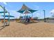 Community playground with colorful play structures, shaded areas, and soft surfacing offers a safe and fun environment for children at 20426 E Arroyo Verde Dr, Queen Creek, AZ 85142