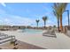 Community pool with lounge chairs and lush landscaping, a perfect spot for relaxation and recreation at 20426 E Arroyo Verde Dr, Queen Creek, AZ 85142