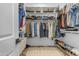 Spacious walk-in closet with ample storage, shelving and racks for clothes and shoes at 20426 E Arroyo Verde Dr, Queen Creek, AZ 85142