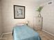 This bedroom has a bed with a blue quilt and a wardrobe, perfect for a relaxing night's sleep at 2123 E Kirkland Ln # 3, Tempe, AZ 85281