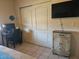 This bedroom has a desk, chair, TV, and closet, perfect for a study or guest room at 2123 E Kirkland Ln # 3, Tempe, AZ 85281