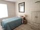 This bedroom features a bed with a blue quilt and a wardrobe, perfect for a cozy retreat at 2123 E Kirkland Ln # 3, Tempe, AZ 85281
