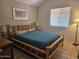 Bedroom with log-frame bed, neutral walls, and tiled floor at 2123 E Kirkland Ln # 3, Tempe, AZ 85281
