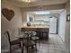 Charming dining area with a skylight and a view into the bright kitchen at 2123 E Kirkland Ln # 3, Tempe, AZ 85281