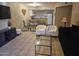 Cozy living area with tile floors, a dining area, and a pass-through kitchen bar at 2123 E Kirkland Ln # 3, Tempe, AZ 85281