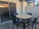 This patio features a table, chairs, and a sliding door, perfect for outdoor dining and relaxation at 2123 E Kirkland Ln # 3, Tempe, AZ 85281