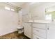 Well-lit bathroom featuring double sinks, shower, and tub combo at 2129 E Yuma Ave, Apache Junction, AZ 85119