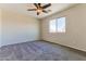 Relaxing bedroom with window, ceiling fan and cozy carpet at 2129 E Yuma Ave, Apache Junction, AZ 85119