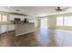 Bright kitchen with stainless appliances, granite countertops, and bar seating at 2129 E Yuma Ave, Apache Junction, AZ 85119
