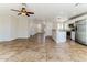 Spacious and bright living room showcasing a modern kitchen with stainless steel appliances at 2129 E Yuma Ave, Apache Junction, AZ 85119