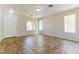Spacious living room featuring tile flooring and a large arched window at 2129 E Yuma Ave, Apache Junction, AZ 85119