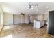 Well-lit living area features a kitchen with stainless steel appliances and granite countertops at 2129 E Yuma Ave, Apache Junction, AZ 85119