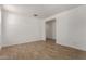 Bedroom featuring wood-look flooring and a passageway to another room at 21348 N Belt Dr, Maricopa, AZ 85138