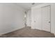 This bedroom has carpet floors, white walls, and a closet at 21348 N Belt Dr, Maricopa, AZ 85138