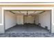 Spacious and clean garage with an automatic door and plenty of room for storage at 21348 N Belt Dr, Maricopa, AZ 85138