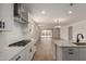 Stylish kitchen featuring stainless steel appliances, granite countertops, and an open floor plan into the dining area at 21348 N Belt Dr, Maricopa, AZ 85138