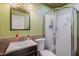 Compact bathroom featuring a shower, toilet, and vanity with a mirror at 2202 W Enid Ave, Mesa, AZ 85202