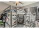 Bedroom featuring a space-saving loft bed design and a dedicated study area at 2202 W Enid Ave, Mesa, AZ 85202