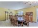 Spacious dining room featuring an ornate wooden table and coordinating furnishings at 2202 W Enid Ave, Mesa, AZ 85202