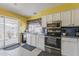 Functional kitchen featuring a stainless steel appliances and ample countertop space for efficient meal preparation at 2202 W Enid Ave, Mesa, AZ 85202