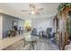 Comfortable living room with a ceiling fan, recliner chairs, and hardwood floors, providing a cozy ambiance at 2202 W Enid Ave, Mesa, AZ 85202