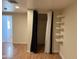 Bedroom features closet space, shelving, and durable wood laminate floors at 235 W Southern Ave # 150, Mesa, AZ 85210