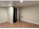 Bright bedroom features stylish laminate floors, built-in shelving, and closet at 235 W Southern Ave # 150, Mesa, AZ 85210
