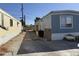 Single Gathering home featuring a small wooden porch and minimal landscaping at 235 W Southern Ave # 150, Mesa, AZ 85210