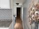 Hallway with laundry area and floral wall art at 235 W Southern Ave # 150, Mesa, AZ 85210