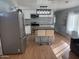 Modern kitchen features stainless steel appliances and eat-in island at 235 W Southern Ave # 150, Mesa, AZ 85210