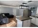 Bright kitchen with eat-in island is adjacent to the living room at 235 W Southern Ave # 150, Mesa, AZ 85210