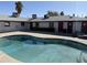 Inviting community pool with cool, clear water and surrounding lounge area with room to relax and enjoy resort-style living at 235 W Southern Ave # 150, Mesa, AZ 85210
