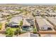 Neighborhood aerial shot highlighting a home with a swimming pool, patio area, and solar panels on the roof at 24638 N 144Th Ave, Surprise, AZ 85387