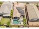 Aerial view of a home with a backyard pool, patio, and solar panels in a desirable neighborhood at 24638 N 144Th Ave, Surprise, AZ 85387