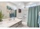 Bright bathroom with stylish vanity, mirror, and bathtub/shower combination at 24638 N 144Th Ave, Surprise, AZ 85387