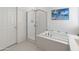 Bright bathroom showcasing a tub, shower, and modern fixtures at 24638 N 144Th Ave, Surprise, AZ 85387
