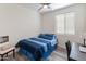 Neutral bedroom with a bed, wood floors, and a ceiling fan at 24638 N 144Th Ave, Surprise, AZ 85387