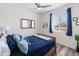 Bedroom with ceiling fan, window, and a warm, inviting atmosphere at 24638 N 144Th Ave, Surprise, AZ 85387