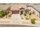 Charming single-Gathering home with a well-manicured front yard, desert landscaping, and a two-car garage at 24638 N 144Th Ave, Surprise, AZ 85387