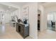 Bright hallway showcasing neutral tones and modern decor leading to other areas of the home at 24638 N 144Th Ave, Surprise, AZ 85387