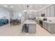 Bright kitchen with a large island, modern appliances, and a seamless flow to the dining area at 24638 N 144Th Ave, Surprise, AZ 85387
