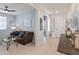 Inviting living room featuring a comfortable brown sofa and stylish decor, perfect for relaxation at 24638 N 144Th Ave, Surprise, AZ 85387