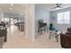 Bright living room with a ceiling fan, brown sofa, and a view of the open floor plan at 24638 N 144Th Ave, Surprise, AZ 85387