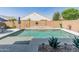 Beautiful backyard pool featuring a decorative water feature, lush landscaping, and ample space for recreation at 24638 N 144Th Ave, Surprise, AZ 85387