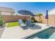 Relaxing poolside lounge area with comfortable seating and shade, perfect for enjoying the Arizona sun at 24638 N 144Th Ave, Surprise, AZ 85387