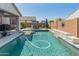 Sparkling swimming pool with lounge chairs and lush landscaping creates a perfect backyard oasis at 24638 N 144Th Ave, Surprise, AZ 85387