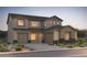 Beautiful two-story home featuring a stylish exterior and well-manicured landscaping at 24871 N 170Th Dr, Surprise, AZ 85387